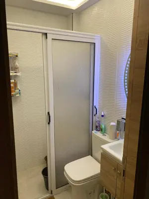 a bathroom with a shower with a toilet and a sink at Jnane meknes 2 in Meknès