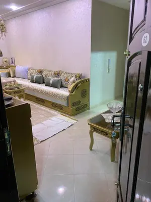 a living room with a couch and a table at Jnane meknes 2 in Meknès
