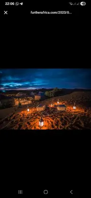 a screenshot of a picture of a desert at night at Luxury sahara in Merzouga
