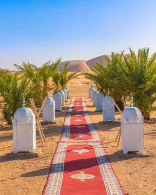 a red carpet in the middle of the desert at Luxury sahara in Merzouga