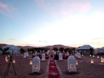 a group of graves with lights in the desert at Luxury sahara in Merzouga