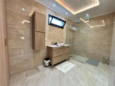 a bathroom with a sink and a shower at Villa Atlas in Aghmat