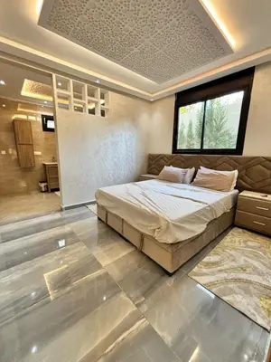 a bedroom with a large bed in a room at Villa Atlas in Aghmat