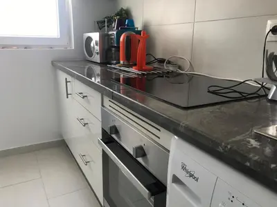 a kitchen with a stove and a counter top at American Style Apt Pool & AC in Oulad Akkou