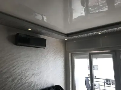 a room with a tv on a wall with a window at Family Flat Pool Chill Vibes in Oulad Akkou