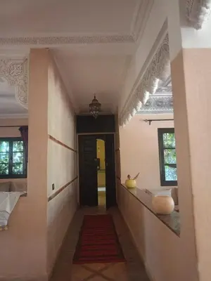 a hallway of a house with a hallway leading to a door at Exceptional villa in Marrakech - privacy and comfort in Heddad