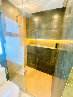 a bathroom with a shower and a toilet at nouvelle studio climatisé in Fès