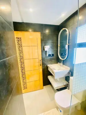 a bathroom with a toilet and a sink and a mirror at nouvelle studio climatisé in Fès