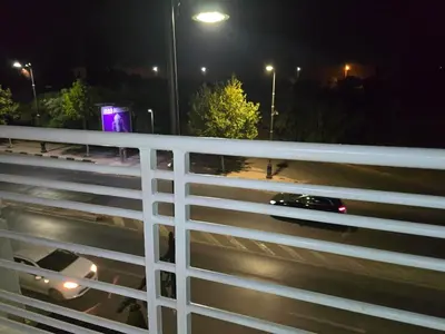 a car driving on a highway at night at joli appartement à petit prix in Meknès