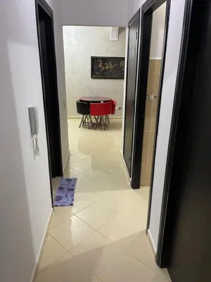 a view of a dining room with a table through a door at Bel Appartement à louer à Fès in Fès