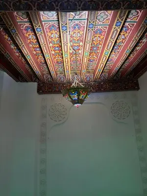 a coffered ceiling with a stained glass ceiling at M & S Guest House in Fès