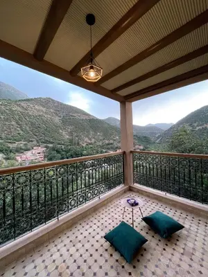 a balcony with a view of the mountains at Dar Dahlia Atlas Valley in Oulad Akkou