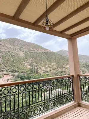 a balcony with a view of a mountain at Dar Dahlia Atlas Valley in Oulad Akkou