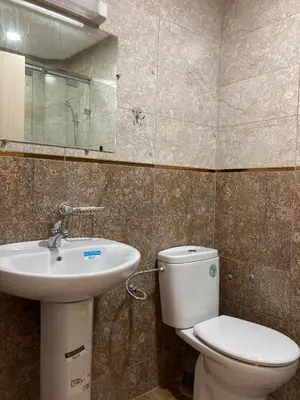 a bathroom with a toilet and a sink at Modern Apartment in Ifrane in Ifrane