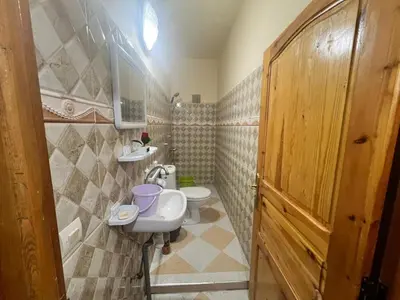 a bathroom with a sink and a toilet at Au centre de la ville pour les familles seulement in Khenifra