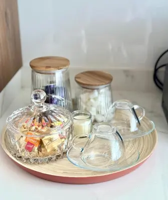a tray with two glass containers on a counter at La casa famille in Oulad Akkou