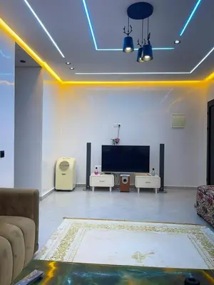 a living room with a tv and a couch at khalid in Oulad Akkou