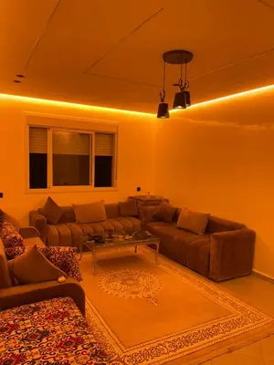a living room with a couch and a table at khalid in Oulad Akkou