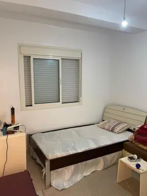 a bedroom with a bed and a window at khalid in Oulad Akkou