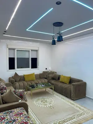 a living room with a couch and a table at khalid in Oulad Akkou