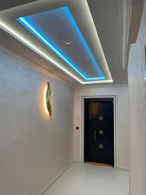 a room with a blue light on the ceiling at khalid in Oulad Akkou