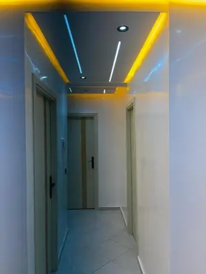 an office hallway with a ceiling with lights at khalid in Oulad Akkou