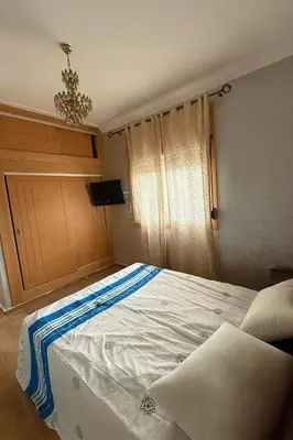 a large bed in a room with at Appartement Pam Pam in Fès