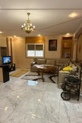 a living room with a couch and a table at Appartement Pam Pam in Fès