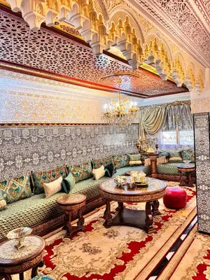 a living room with a couch and a table at Villat Riad, fête style marocain in Oulad Akkou