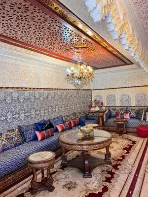 a living room with a couch and a table at Villat Riad, fête style marocain in Oulad Akkou