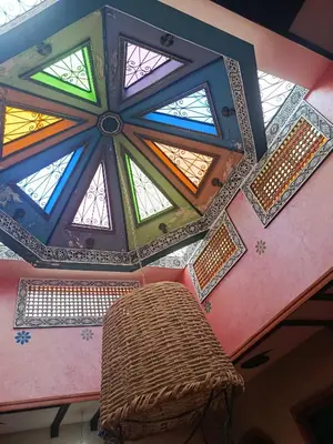 a room with a ceiling with stained glass windows at Africa Hollywood in Aït Ben Haddou