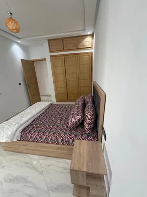 a bedroom with a bed in a room at Luxurious apartment in Oud Fes golf city in Fès