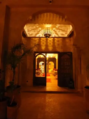 an entry way to a building with a chandelier at Palm Dades in Boumalne