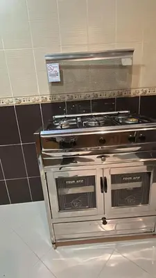 a stainless steel stove in a kitchen at Luxurious apartment at a low price in Meknès