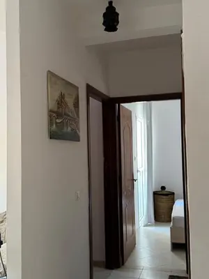 a hallway with an open door to a room at Fès comfort stay in Fès