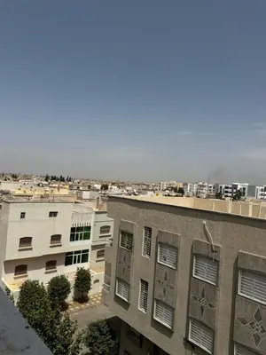 an apartment building with graffiti on the side of it at Fès comfort stay in Fès