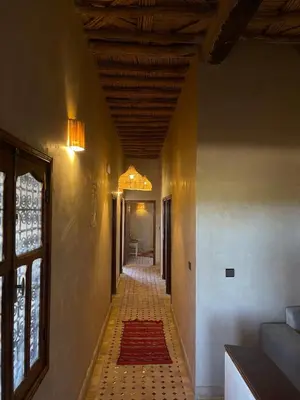 a hallway with a tile floor and a ceiling at Skoura Ranch Palm Grove in Ouarzazate