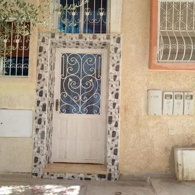 a door on a building with a tile at Vip apartment in Fès