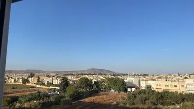 a view of a city with mountains in the background at You'll be comfortable there! in Fès