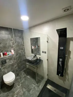 a bathroom with a toilet and a sink at You'll be comfortable there! in Fès