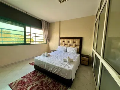 a bedroom with a bed with two candles on it at Fes City Luxury Suites - Apartments & Studio in Fès