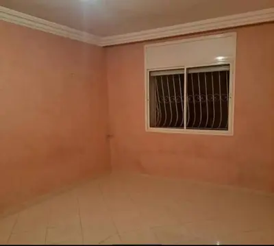 a room with a window and a tiled floor at Abdeslam in Kasba Tadla