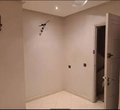 an empty room with a bird on the wall at Abdeslam in Kasba Tadla