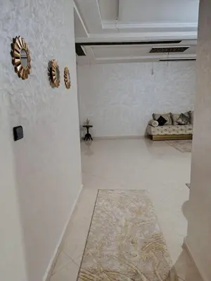 a living room with a couch in a room at Dar araha in Fès