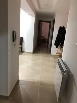 a hallway with a tile floor and a radiator at essaouira appartement borito in Oulad Akkou