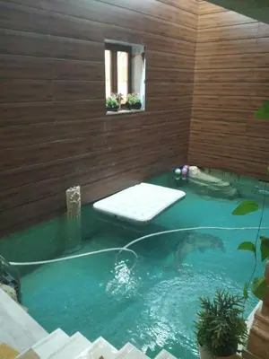 a swimming pool with a tub in a house at essaouira appartement borito in Oulad Akkou