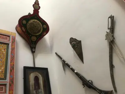 a wall with several different types of items on it at Reggae Riad in Fès