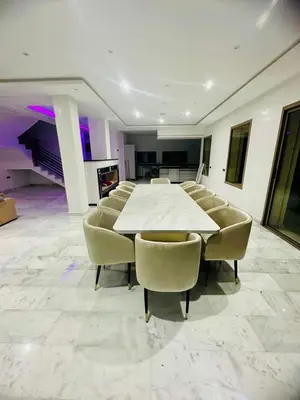 a conference room with a white table and chairs at Villa Itran Marrakech in Aguelmous