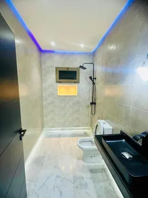 a bathroom with a sink and a toilet and a shower at Villa Itran Marrakech in Aguelmous