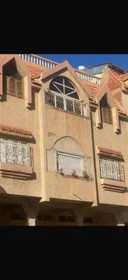 a building with two balconies on the side of it at Azrou in Azrou